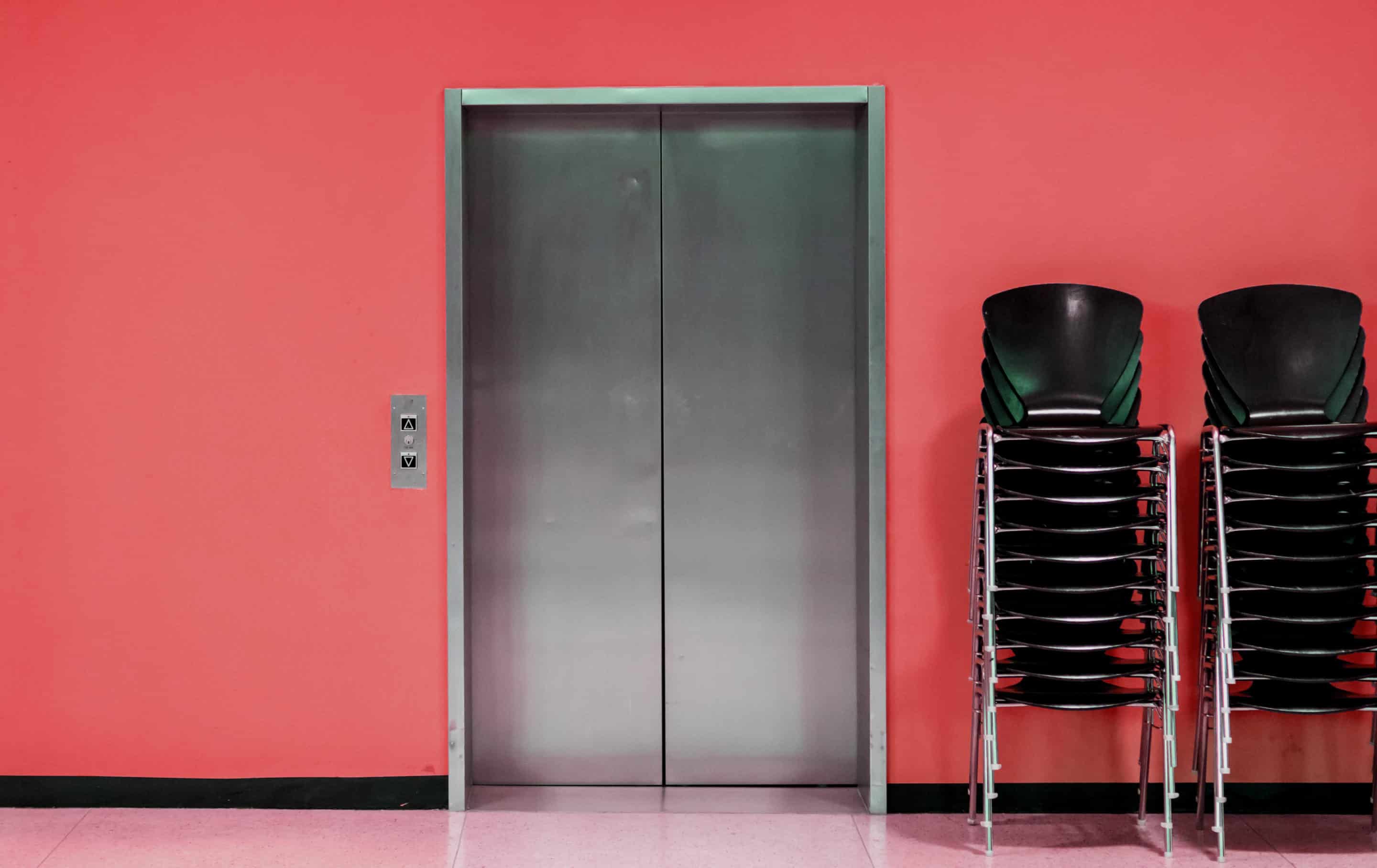elevator with keri red paint The front of an elevator for a business